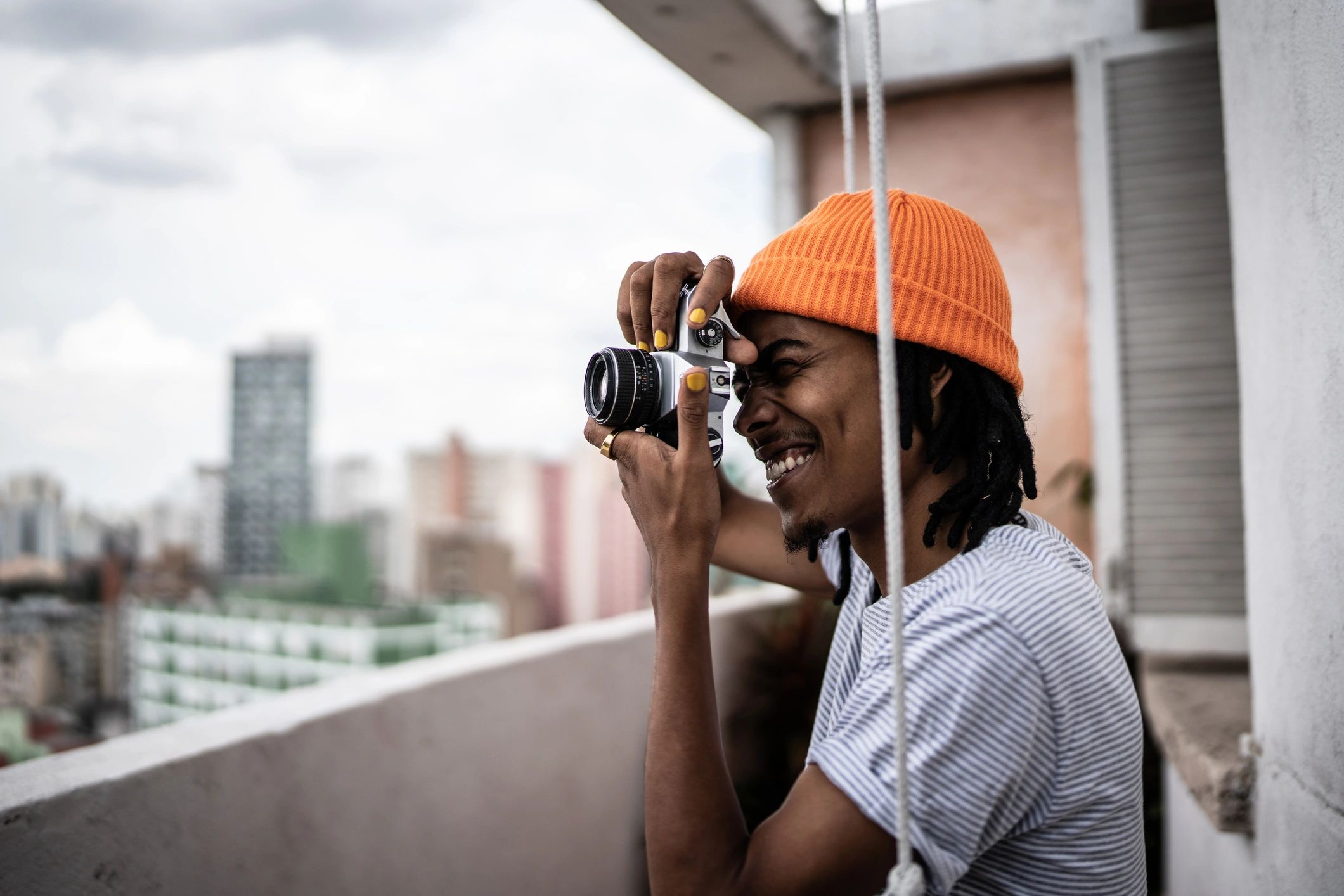 Photographer taking photos from a balcony