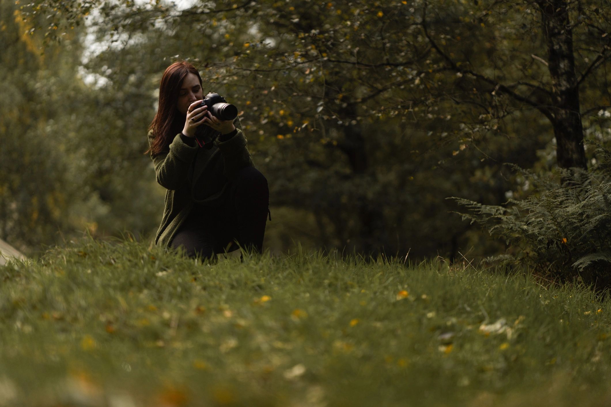 Photographer capturing a portrait session outdoors
