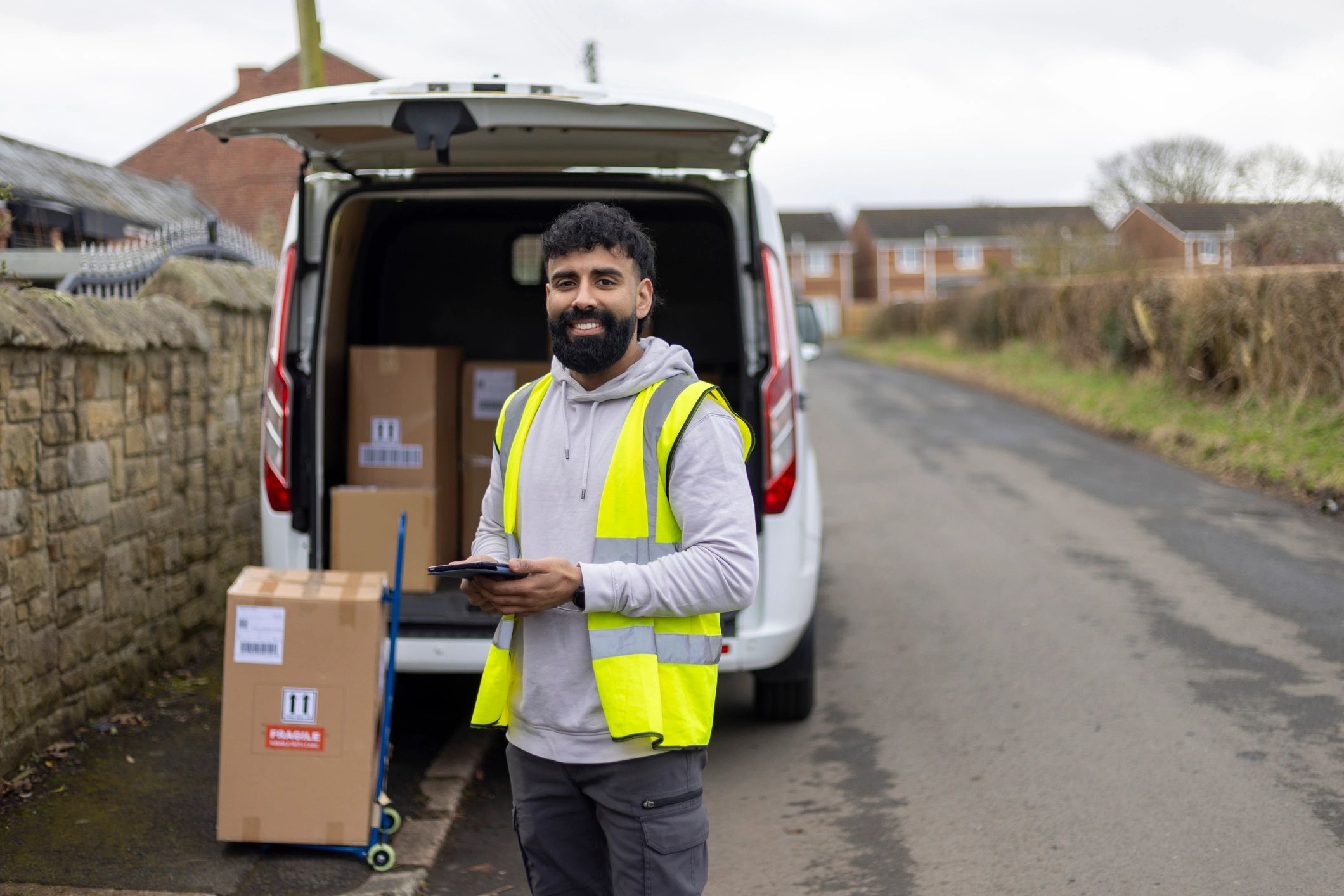 Lifestyle portrait of a delivery driver outdoors