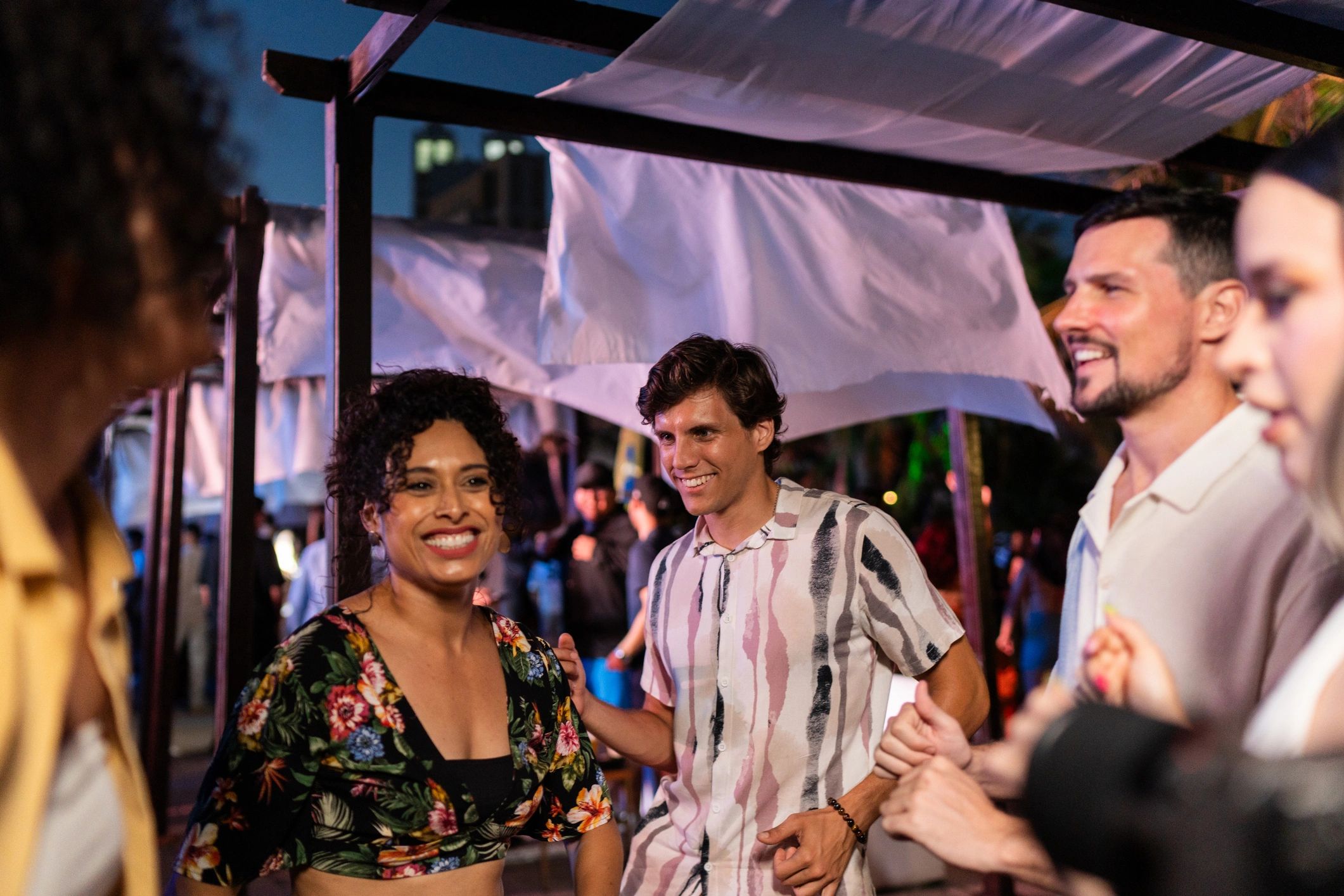 Friends dancing at a music festival