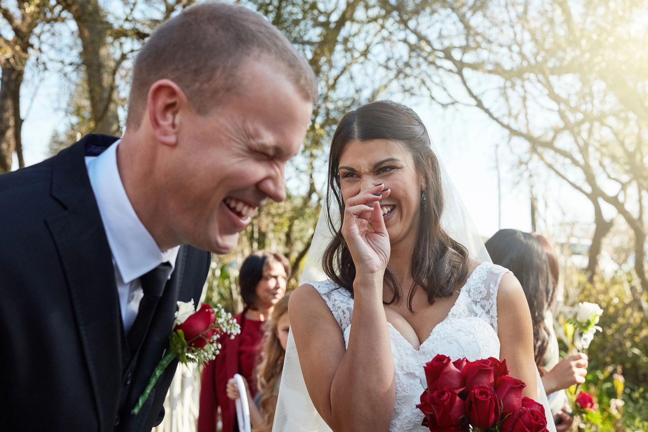 Bride and groom standing outdoors on their wedding day